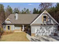 Charming home featuring stone accents, gray siding, and a two-car garage at Lot 1 Perkins Rd, Dallas, GA 30157
