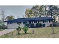 Charming ranch-style home with freshly landscaped front yard and inviting curb appeal at 1735 W Austin Rd, Decatur, GA 30032
