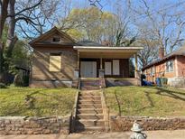 Exterior of home with front steps leading to the front door and yard at 707 Dill Sw Ave, Atlanta, GA 30310