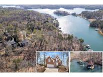 Stunning aerial view of lakefront property featuring lush greenery and private boat docks at 7725 Bold Springs Xing, Cumming, GA 30041