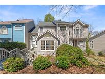 Charming townhome featuring a well-maintained front yard and inviting architectural details at 1661 Paddlewheel Dr, Marietta, GA 30062