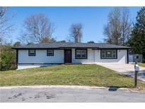Charming ranch-style home with a well-manicured lawn and a classic, inviting facade at 54 Jean Ct, Hiram, GA 30141