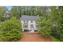 Charming two-story home with a landscaped yard and a welcoming front entrance at 1945 Wenlok Ne Trl, Marietta, GA 30066