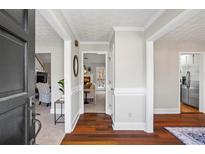 Bright foyer with hardwood floors flowing into other rooms, a charming entry to a comfortable home at 6009 Wyndham Woods Dr, Powder Springs, GA 30127