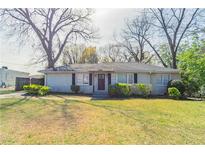 Charming single-story home featuring a well-maintained lawn and mature trees at 2062 Whites Mill Rd, Decatur, GA 30032
