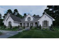 Charming farmhouse-style home featuring a welcoming front porch and beautiful landscaping at 237 Barbara Sw Ln, Mableton, GA 30126