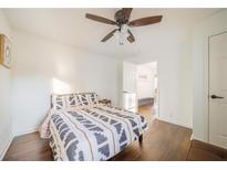 Bright bedroom features a ceiling fan, natural light, and clean, neutral decor at 1893 Windsor Sw Dr, Atlanta, GA 30311
