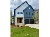 Charming two-story home features two car garage, brick accents, and manicured lawn at 2587 Apple Valley Rd, Brookhaven, GA 30319
