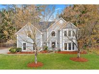 Charming two-story traditional home with gray siding, white trim, and manicured front yard at 3993 Amberley Ln, Marietta, GA 30062