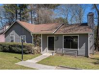 Charming single-Gathering home with stone accents, well-maintained lawn, and inviting front entrance at 910 Brandon Hill Way, Jonesboro, GA 30238