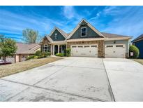 Charming home with a three-car garage, stone accents, and a well-manicured lawn at 161 Dorys Way, Dallas, GA 30157