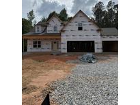 New construction home featuring a two-story design and an attached two-car garage at 210 Pinewood Dr, Covington, GA 30014