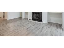 Living room showcasing wood-look floors, a fireplace, and built-in shelving at 320 Park Ridge Cir, Marietta, GA 30068