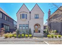 Charming two-story home with white brick, an arched entry, manicured landscaping and welcoming curb appeal at 250 4Th St, Fayetteville, GA 30214