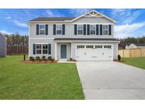 Charming two-story home with a well-manicured lawn and a two-car garage at 8470 Limerick Lane Dr, Winston, GA 30187
