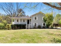 Charming two-story home with a welcoming front porch and well-manicured lawn at 3582 Ontario Ct, Buford, GA 30519