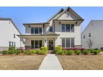 Inviting two-story home with manicured lawn, classic architecture, and charming curb appeal at 241 3Rd Ave, Avondale Estates, GA 30002