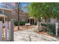 Inviting townhouse exterior with a charming walkway and a cozy front bench at 2209 N Forest Trl, Dunwoody, GA 30338