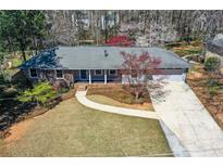 Charming single-story home with well-maintained lawn, driveway, and welcoming front porch at 1564 Pedro Sw Dr, Mableton, GA 30126