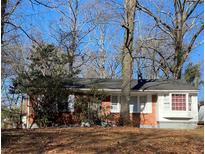 Charming brick home featuring a well-maintained lawn and a classic architectural style at 2368 Jernigan Se Pl, Atlanta, GA 30315