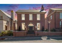 Stunning brick home featuring a classic architectural design with a beautiful front entrance at 220 3Rd St, Fayetteville, GA 30214