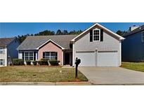 Charming single-Gathering home with a brick and vinyl facade and a well-manicured front yard at 3035 Sherbourne Dr, Lithonia, GA 30058