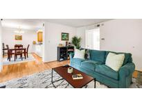 Cozy living room featuring modern decor, a plush sofa, and hardwood floors at 1445 Monroe Dr # F30, Atlanta, GA 30324