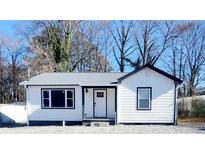 Charming single story home with a well-maintained yard and inviting front door entrance at 766 Allgood Rd, Marietta, GA 30062
