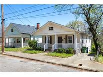 Charming craftsman-style home with inviting front porch and well-maintained landscaping at 900 Oakhill Sw Ave, Atlanta, GA 30310