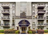 Exterior view of the The James at Buckhead featuring balconies, a large window, and neatly manicured landscaping at 3203 Lenox Ne Rd # 3, Atlanta, GA 30324