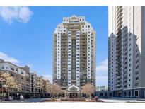 Full exterior shot of the building featuring a beige facade and private balconies in a modern design at 795 Hammond 1013 Dr, Sandy Springs, GA 30328