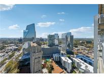 Stunning aerial view showcasing the city skyline and the surrounding urban landscape on a sunny day at 3324 Peachtree Ne Rd # 2808, Atlanta, GA 30326