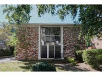 Charming brick multi-Gathering home with large windows and mature trees on a sunny day at 3668 Kingsboro Ne Rd # 6, Atlanta, GA 30319