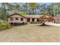 Charming brick home with well-maintained landscaping and a welcoming entrance at 1714 Zemory Dr, Tucker, GA 30084