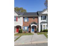 Charming townhouses with colorful doors, shutters, and well-manicured landscaping at 33 Timber Ridge Dr, Cartersville, GA 30121
