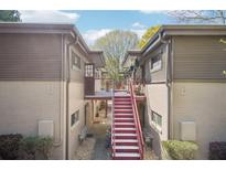 Exterior view of apartment complex featuring red stairs and exterior corridors at 1355 Euclid Ne Ave # B24, Atlanta, GA 30307