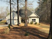 Charming one story home featuring an attached garage and a well-maintained front yard at 197 Buckhorn Dr, Temple, GA 30179
