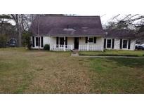 Charming single-story home featuring a cozy front porch and a traditional, well-maintained lawn at 2326 Noahs Ark Rd, Jonesboro, GA 30236