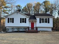 Charming single-Gathering home with a red front door and a well-maintained front yard at 89 Paces Lakes Pt, Dallas, GA 30157