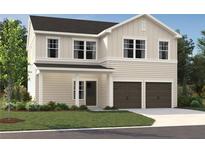 Charming two-story home with a covered entryway, two-car garage, and manicured front lawn at 2096 Boxwood Cir, Conyers, GA 30094