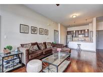 Inviting living room with hardwood floors and an open floorplan to the kitchen at 898 Oak Sw St # 1101, Atlanta, GA 30310