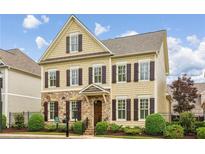 Charming two-story home with brown shutters, stone accents, landscaped yard and a welcoming front entrance at 4224 Gateland Ave, Marietta, GA 30062