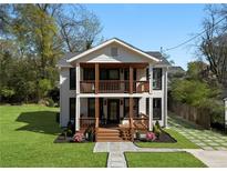 Charming two-story home with double porches, landscaped yard, and modern finishes at 3336 Myrtle St, Atlanta, GA 30354