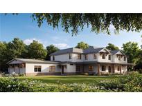 Charming two-story home with white siding, complemented by lush landscaping at 4385 Hickory Flat Hwy, Canton, GA 30115