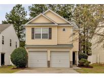 Charming two-story home featuring a two-car garage and a well-maintained lawn at 3417 Sable Chase Ln, Atlanta, GA 30349