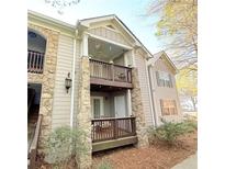Charming multi-story condo with stone accents and inviting balconies at 507 Madison Se Ct, Smyrna, GA 30080