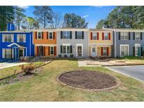 Charming townhomes with colorful facades and inviting landscaping at 2970 Aspen Woods Entry, Atlanta, GA 30360