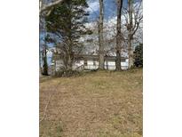 Charming home with mature trees and a well-maintained yard at 3944 Fairburn Rd, Douglasville, GA 30135