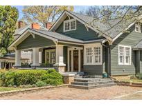Charming craftsman-style home with a welcoming front porch, lush landscaping, and a well-maintained exterior at 637 Linwood Ne Ave, Atlanta, GA 30306
