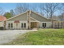 Charming home with a stone facade, well-maintained lawn, and inviting front entrance at 302 Vinson Mountain Loop, Rockmart, GA 30153